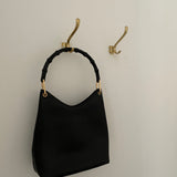 Vintage Gucci Bamboo bag with black handle and gold hardware.