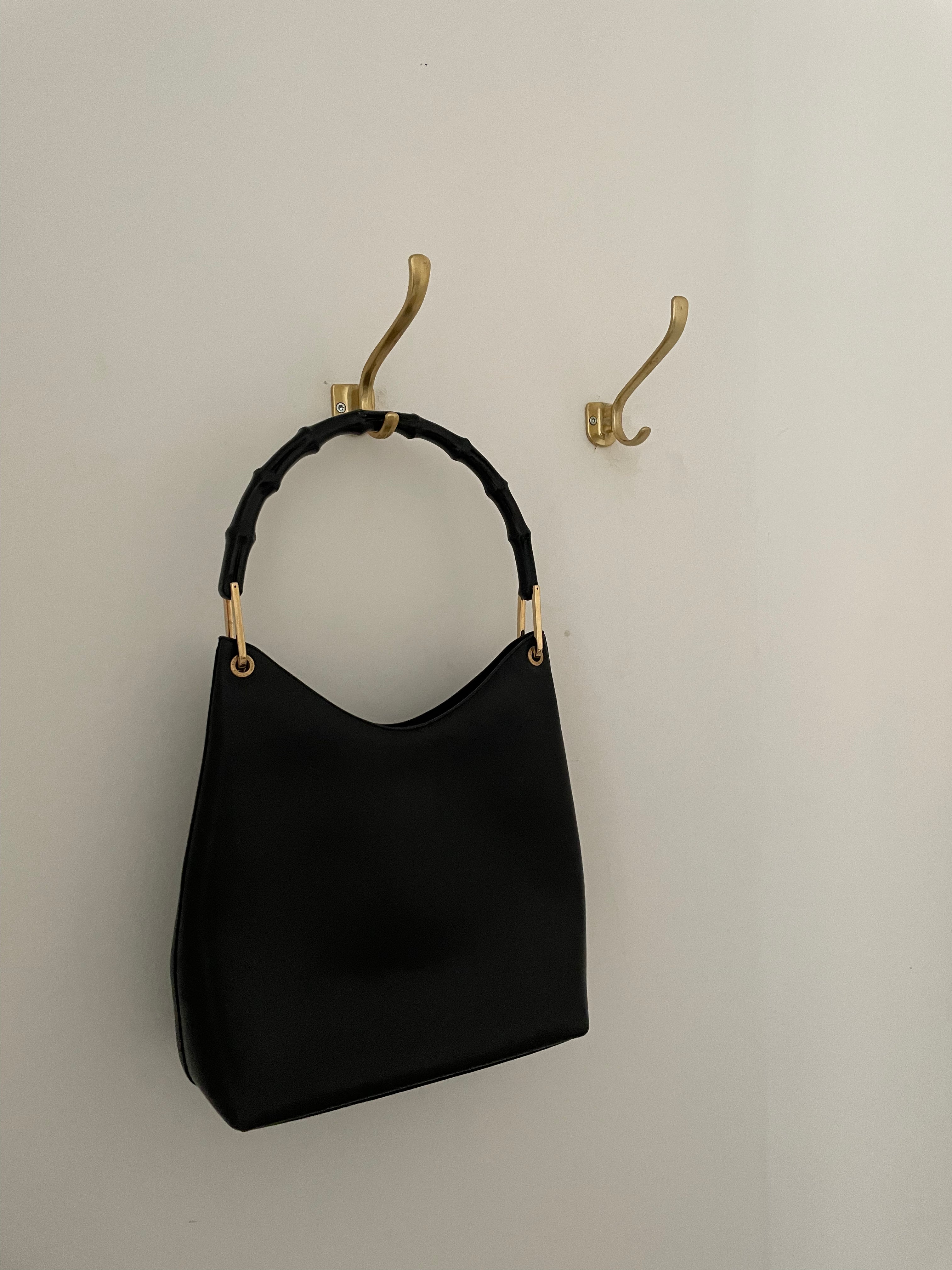 Vintage Gucci Bamboo bag with black handle and gold hardware.