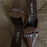 Prada buckle kitten heels. Vintage Prada heels with a pointed toe in a tan color with silver details.