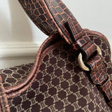 This is a Celine Macadam Bitter Sweet handbag, showcasing the brand's iconic macadam pattern. The bag features a combination of brown canvas and croc-embossed leather details, accentuated by gold-tone hardware.&nbsp;