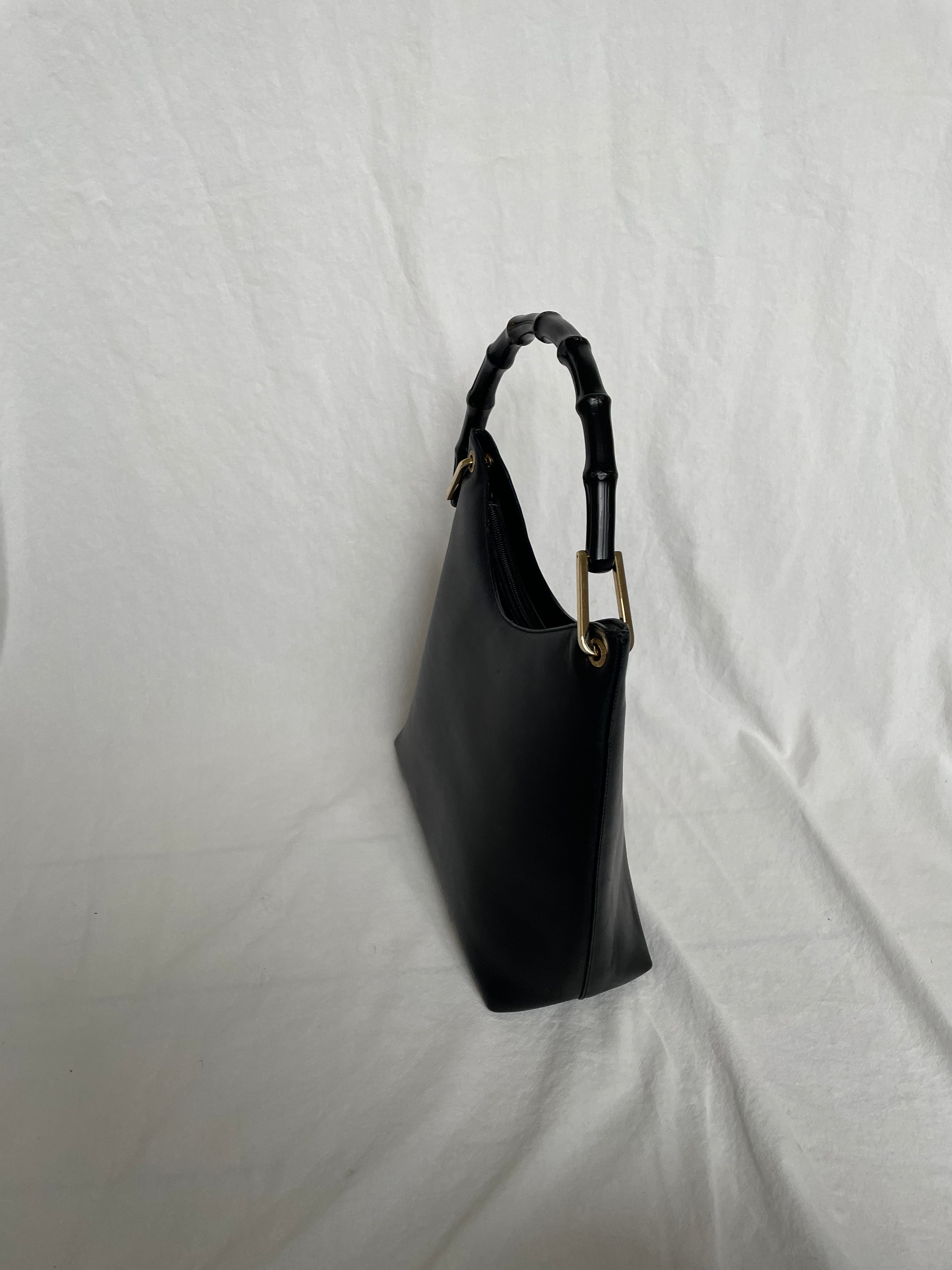 Vintage Gucci Bamboo bag with black handle and gold hardware.