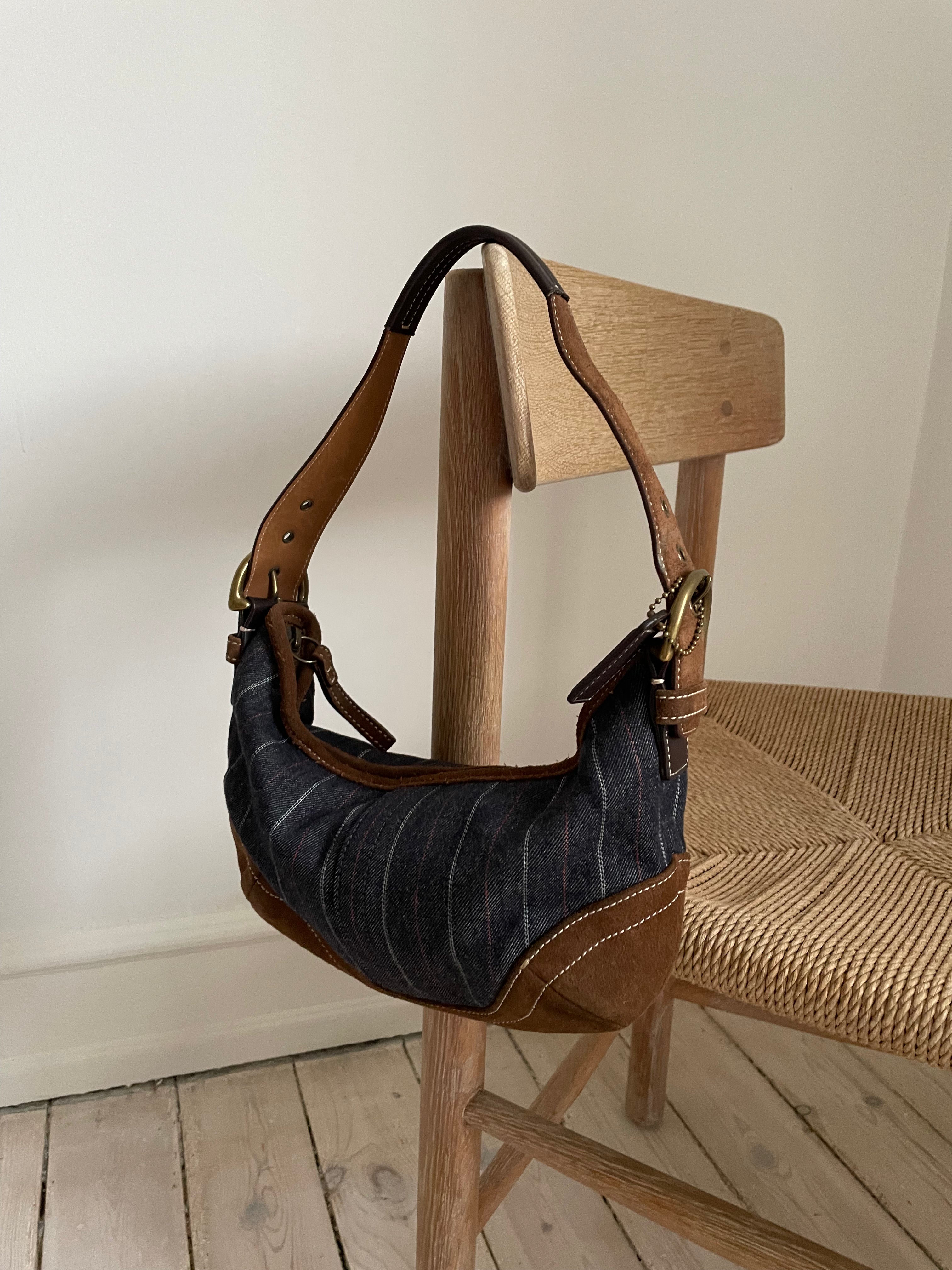 A beautiful vintage Coach in blue denim and brown suede with gold-colored hardware.