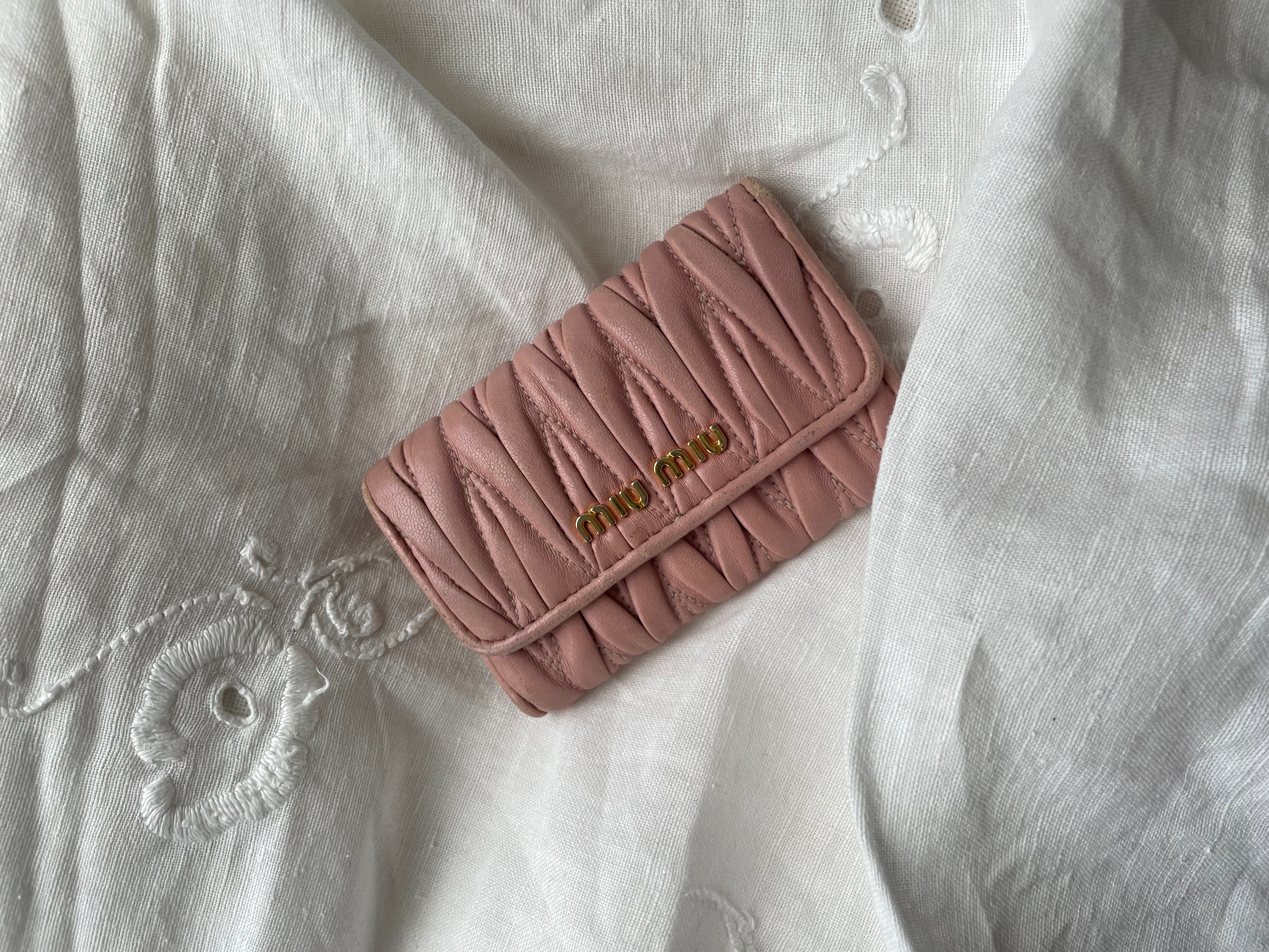 Miu Miu wallet in soft pink leather with a signature matelassé pattern.