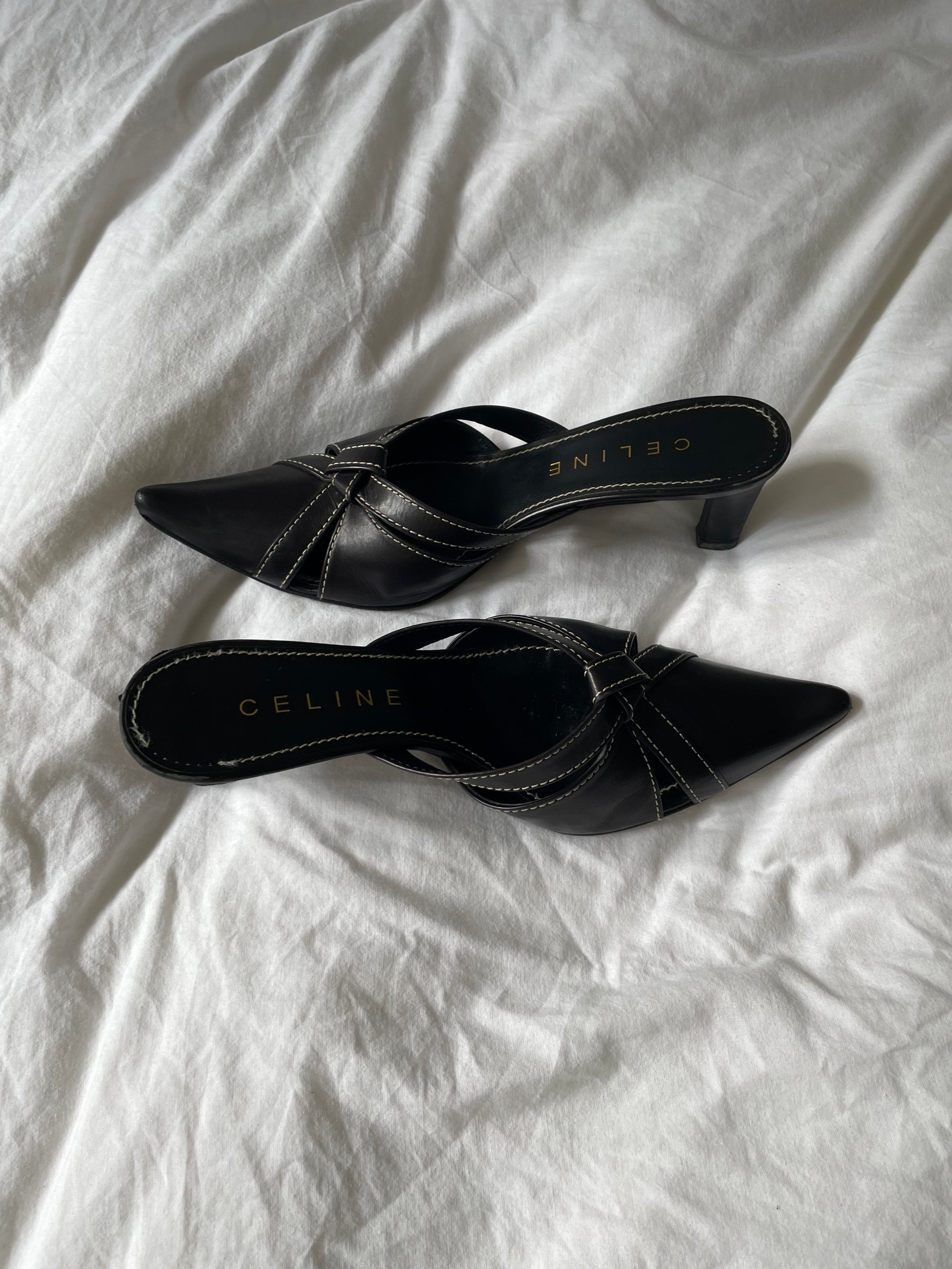 Celine heels in leather with white stitching. They show signs of wear but still have many wears left.