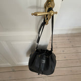 Vintage Burberrys bucket bag featuring signature canvas in the interior. The bag is overall in a good condition but the leather strap show signs of wear.&nbsp;